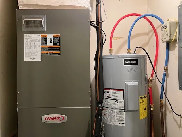 a view of a dry yard with wooden fence