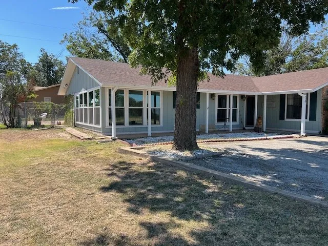 a house with trees in front of it
