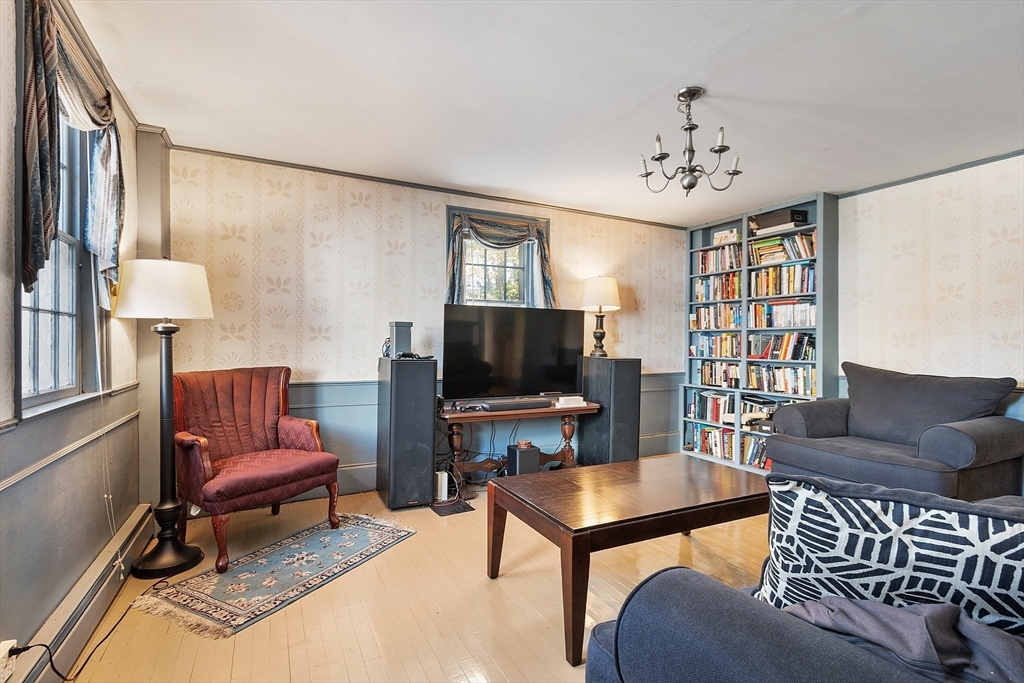 17 Maple Street Sterling, MA 01564 - Photo 21 of 42 a living room with furniture and a flat screen tv