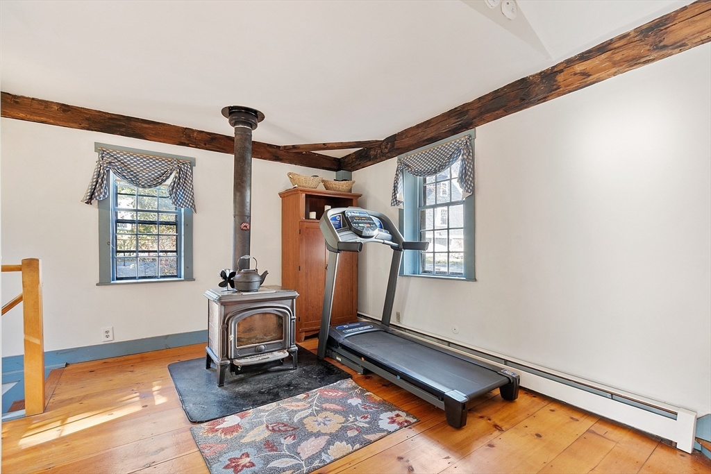 17 Maple Street Sterling, MA 01564 - Photo 23 of 42 a room with gym equipment and a window
