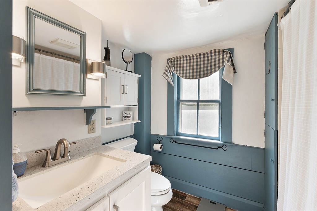 17 Maple Street Sterling, MA 01564 - Photo 24 of 42 a bathroom with a sink a toilet and a mirror