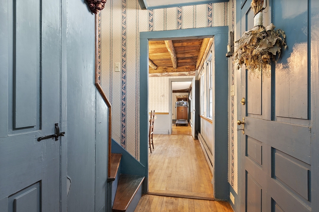 17 Maple Street Sterling, MA 01564 - Photo 25 of 42 a view of a hallway with wooden floor and entryway