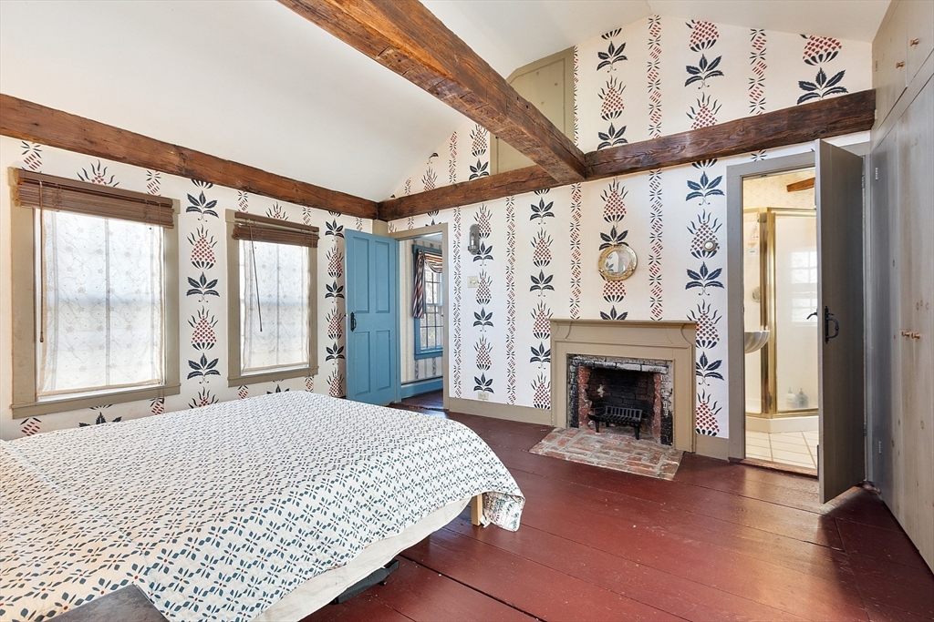 17 Maple Street Sterling, MA 01564 - Photo 30 of 42 a bedroom with a bed and a fireplace