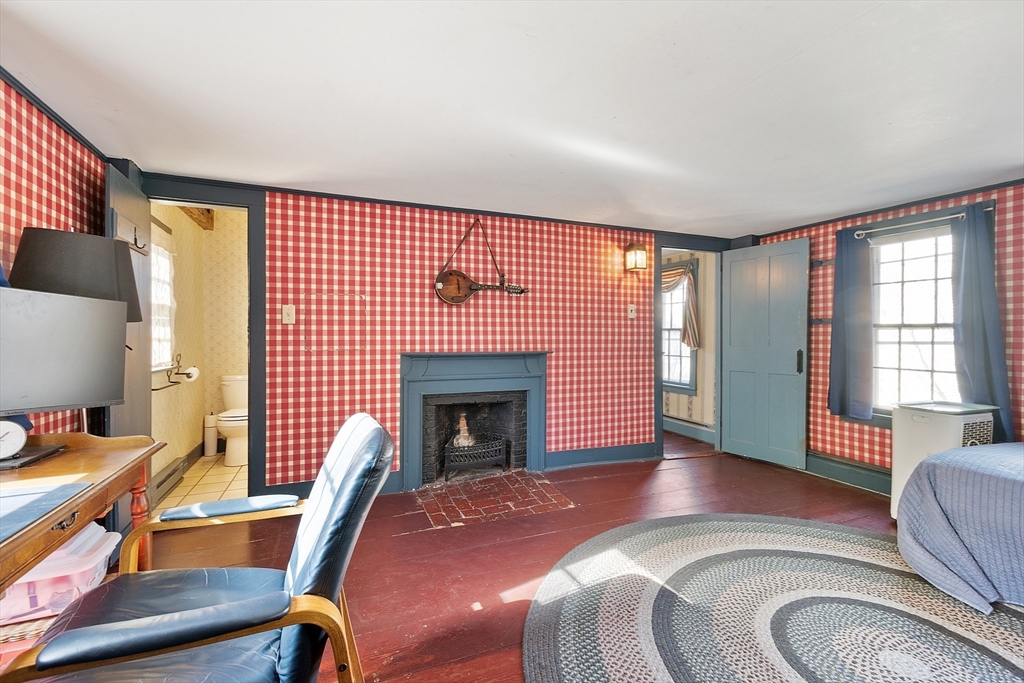 17 Maple Street Sterling, MA 01564 - Photo 32 of 42 a livingroom with furniture a fireplace and wooden floor