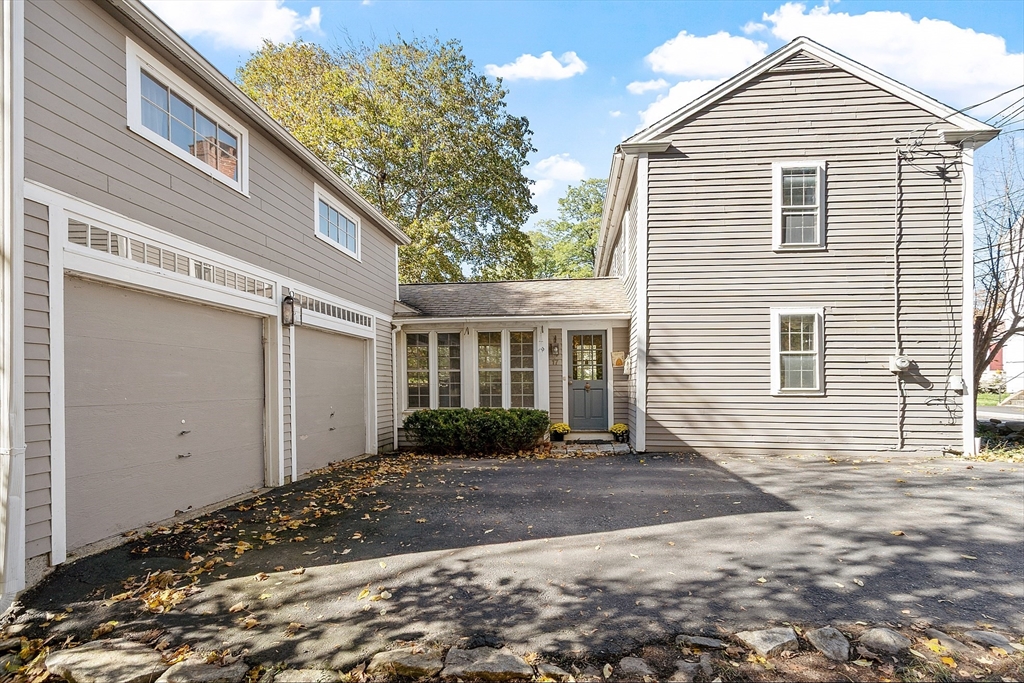 17 Maple Street Sterling, MA 01564 - Photo 5 of 42 a front view of a house with a yard