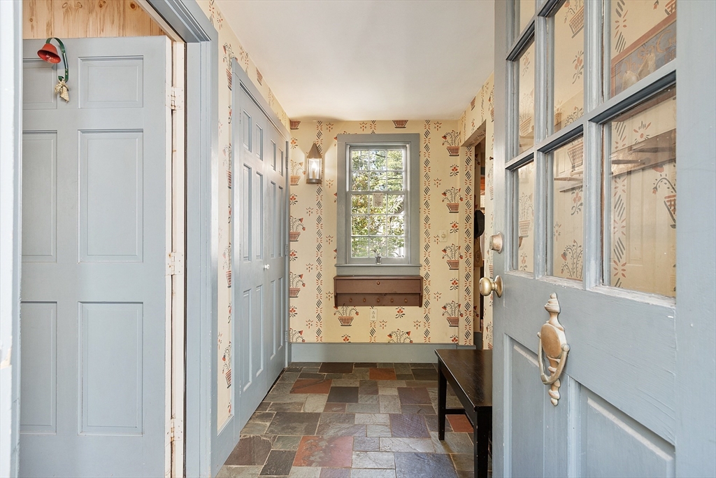 17 Maple Street Sterling, MA 01564 - Photo 7 of 42 a view of an entryway with wooden floor and windows