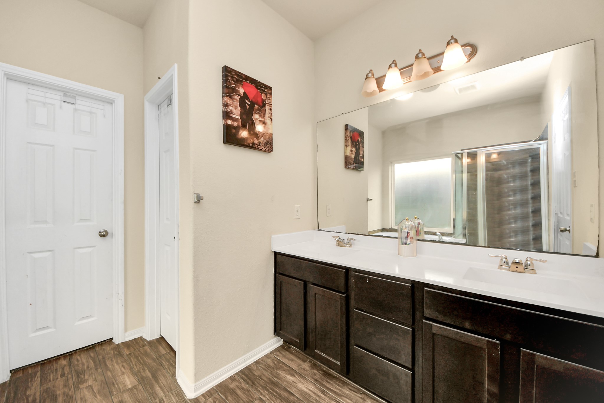 8227 Pastel Dawn Trace Houston, TX 77049 - Photo 13 of 29 a bathroom with a sink and a mirror