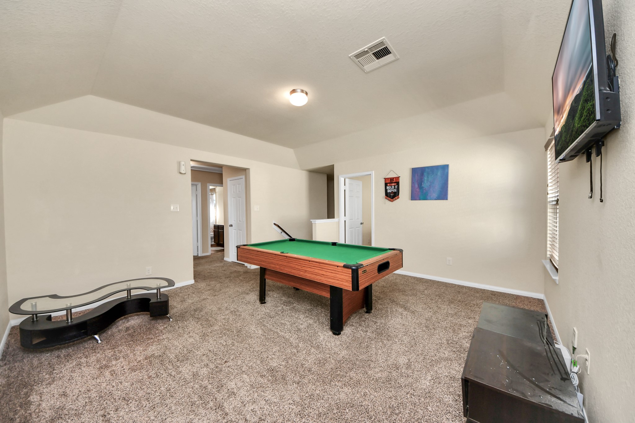 8227 Pastel Dawn Trace Houston, TX 77049 - Photo 17 of 29 a room with pool table and a projector