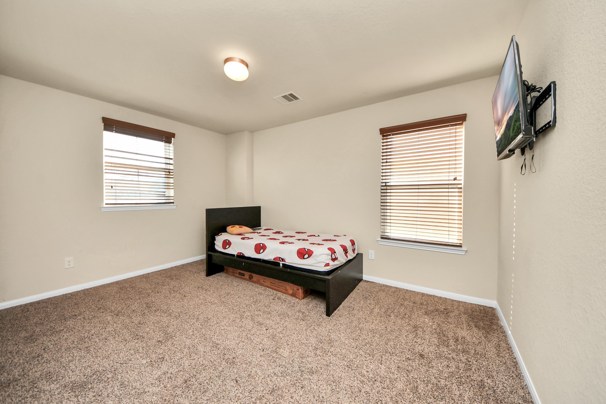 8227 Pastel Dawn Trace Houston, TX 77049 - Photo 20 of 29 a living room with a bed and a window