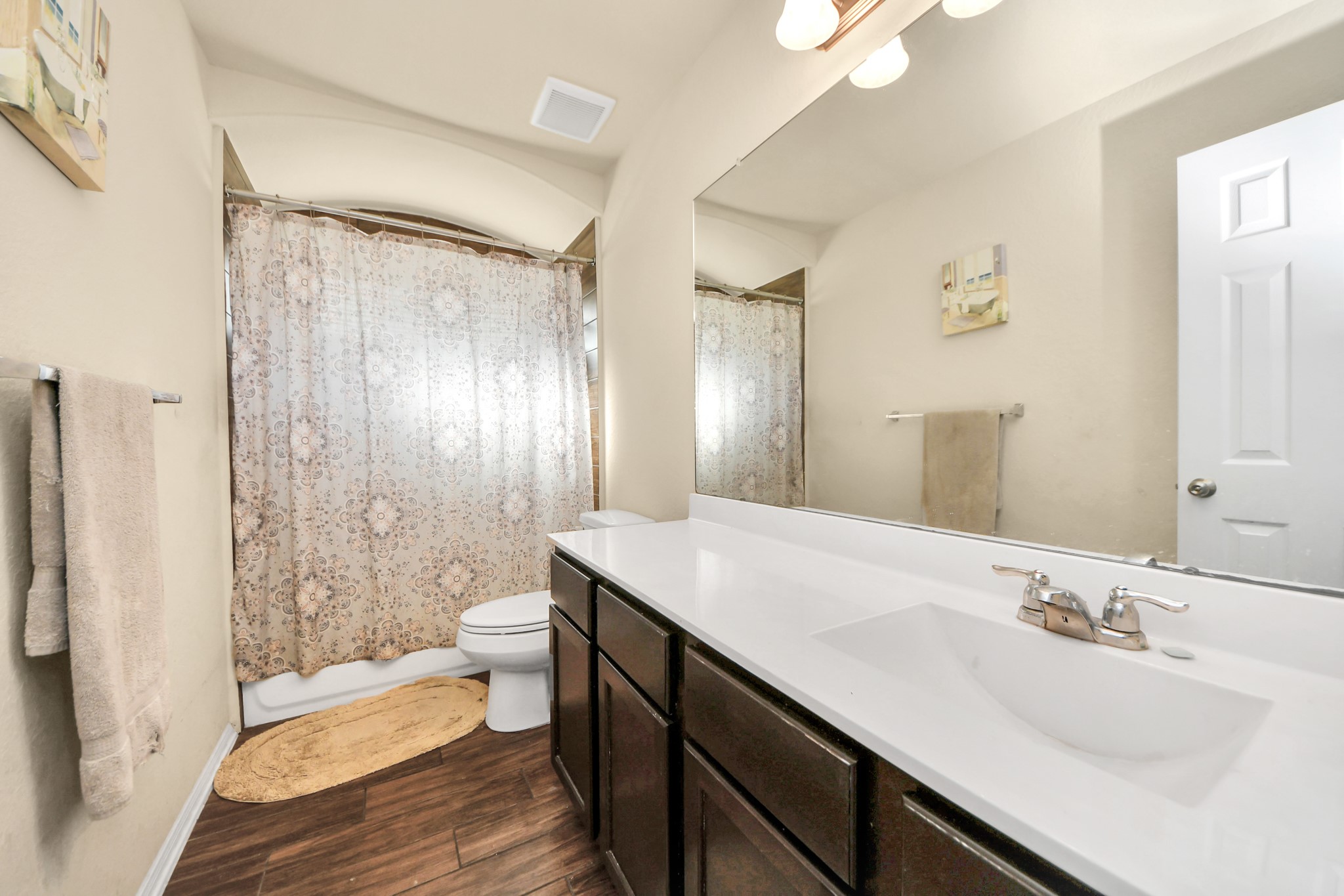 8227 Pastel Dawn Trace Houston, TX 77049 - Photo 21 of 29 a bathroom with a double vanity sink toilet and shower