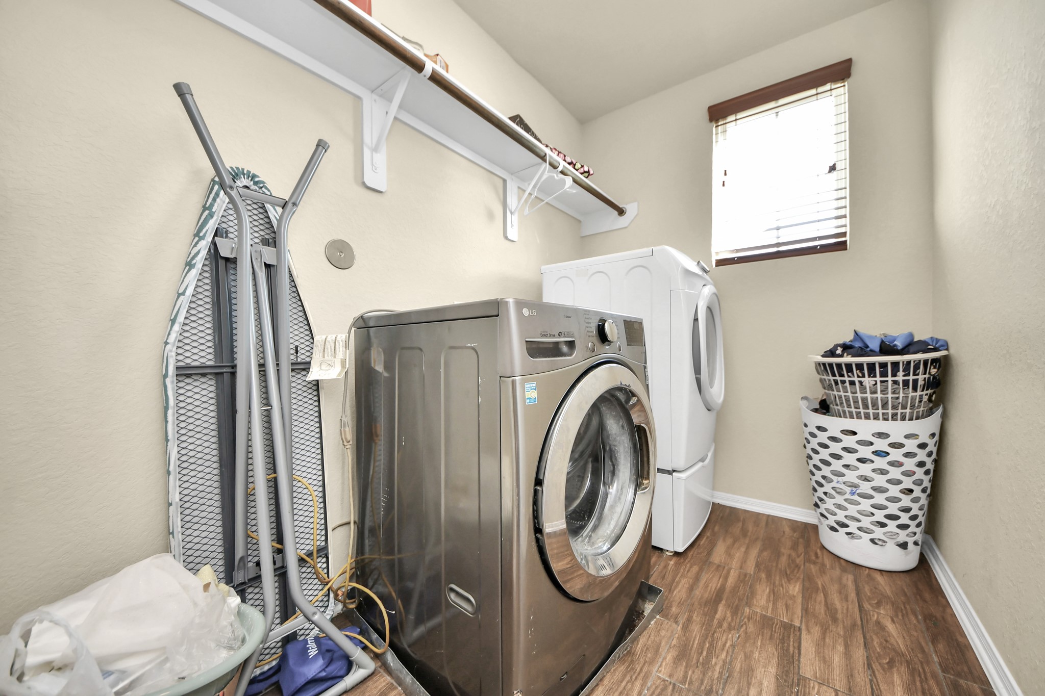8227 Pastel Dawn Trace Houston, TX 77049 - Photo 23 of 29 a utility room with dryer and washer