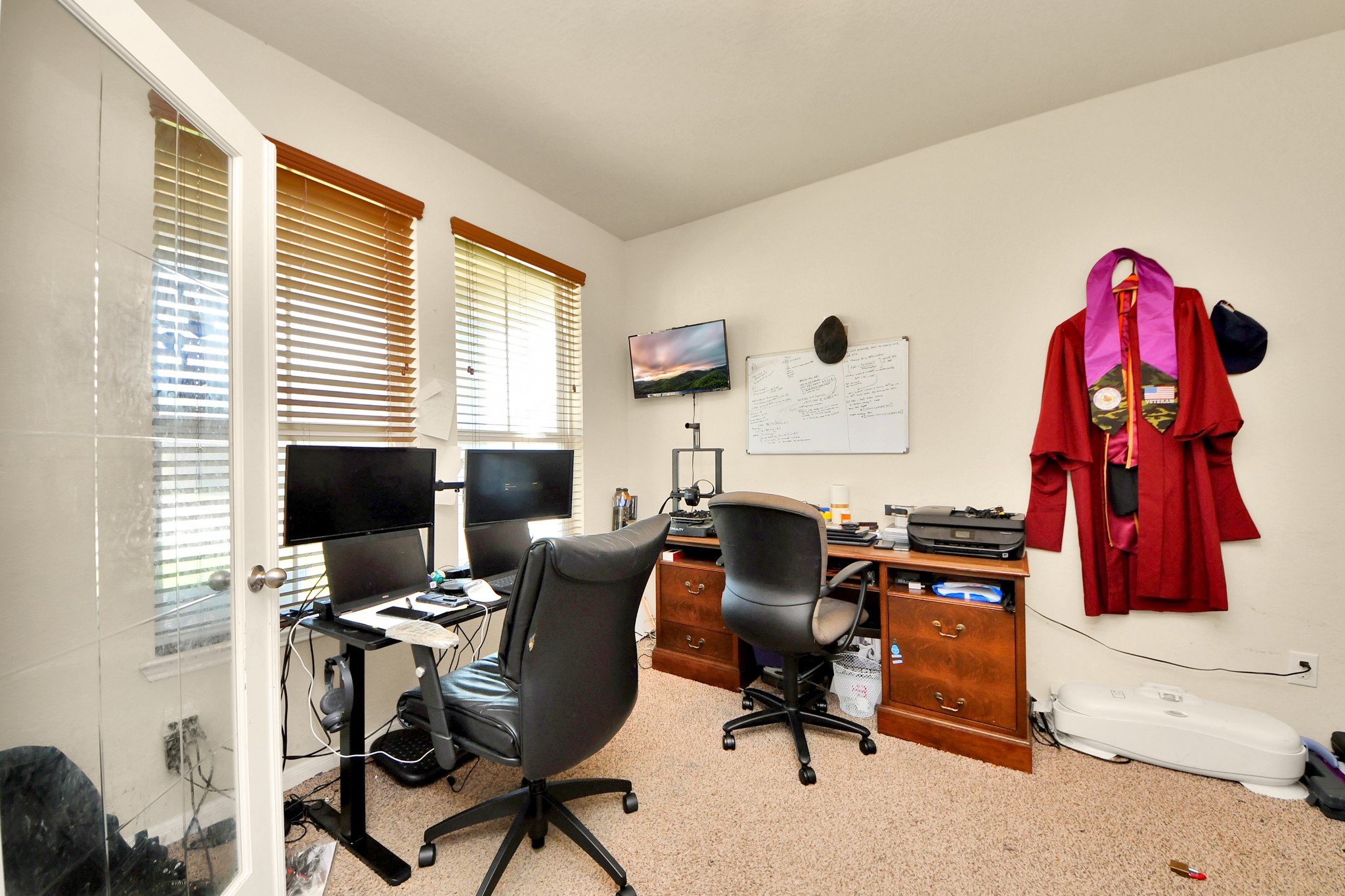 8227 Pastel Dawn Trace Houston, TX 77049 - Photo 24 of 29 a view of a workspace with furniture and a window