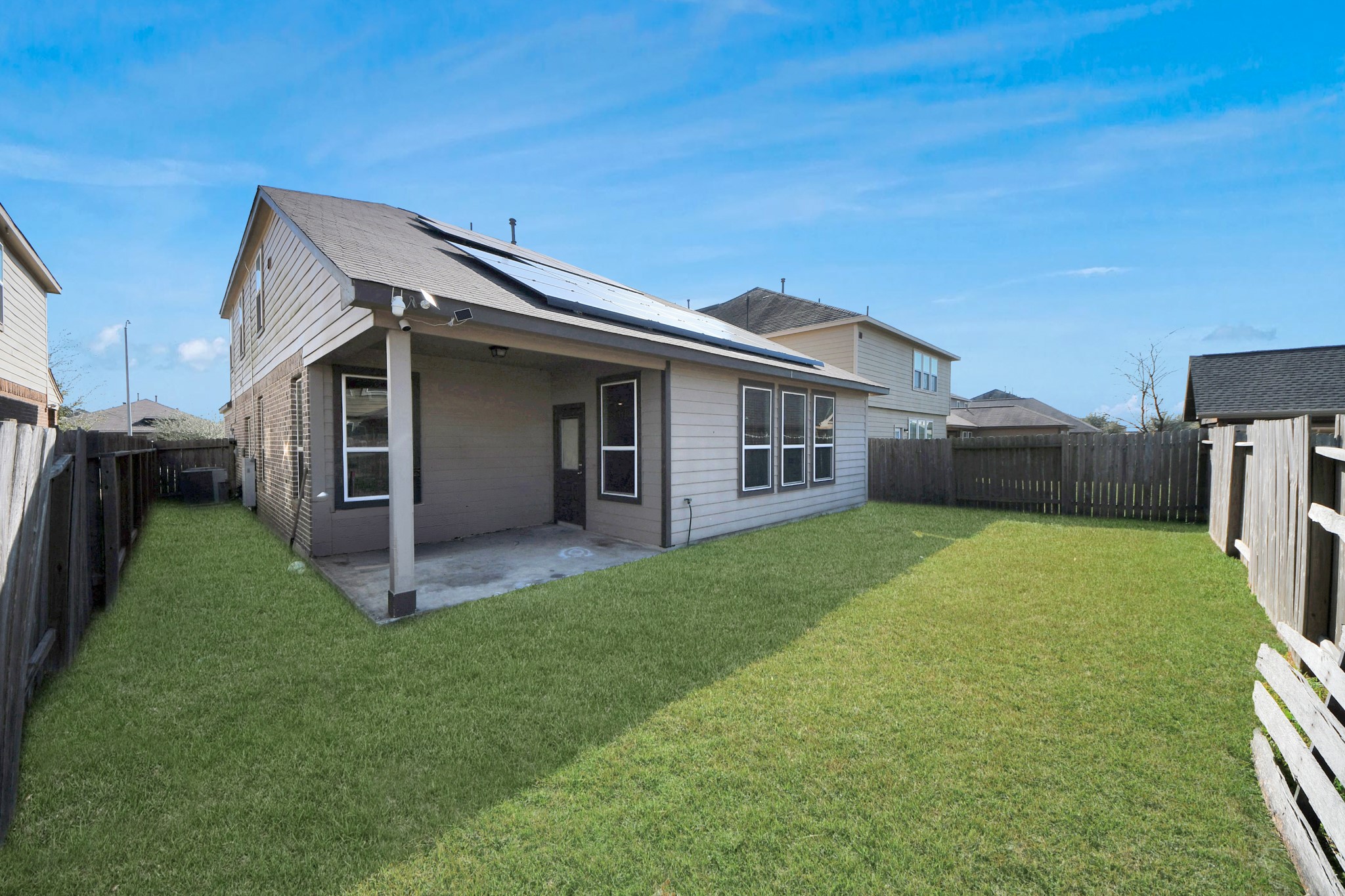 8227 Pastel Dawn Trace Houston, TX 77049 - Photo 26 of 29 a backyard of a house with table and chairs