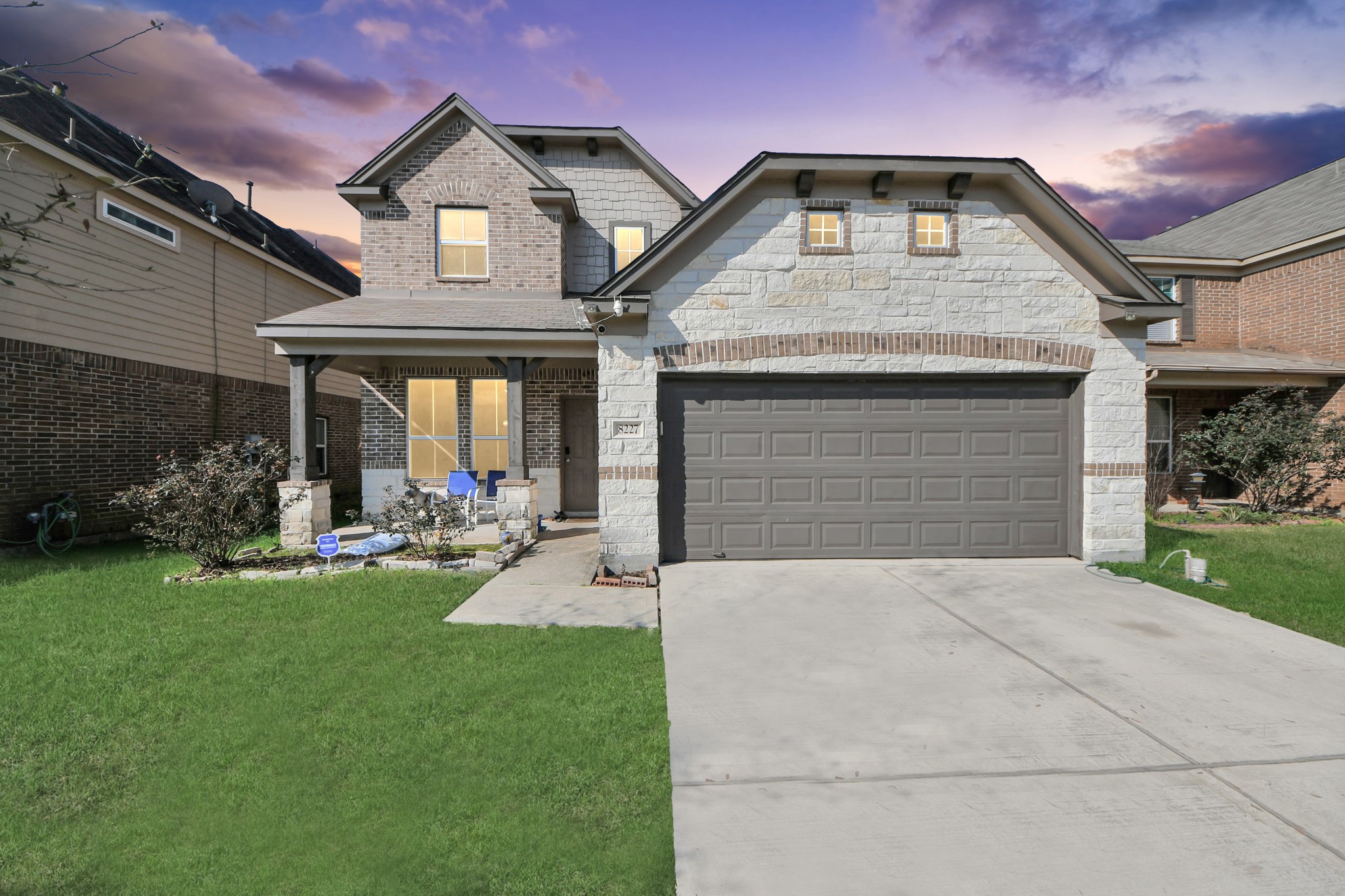 8227 Pastel Dawn Trace Houston, TX 77049 - Photo 29 of 29 a front view of a house with a yard