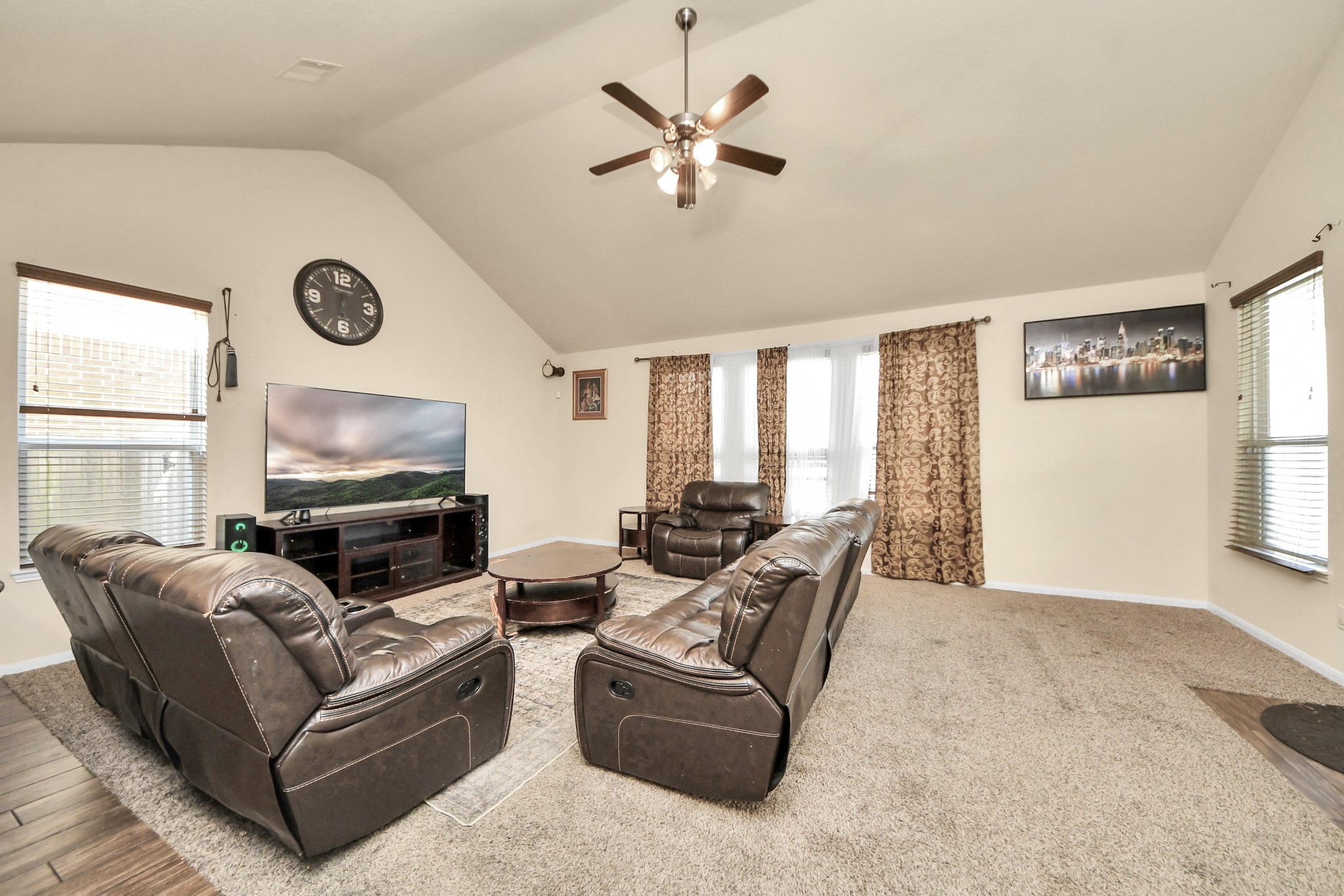 8227 Pastel Dawn Trace Houston, TX 77049 - Photo 6 of 29 a living room with furniture a large window with a flat screen tv