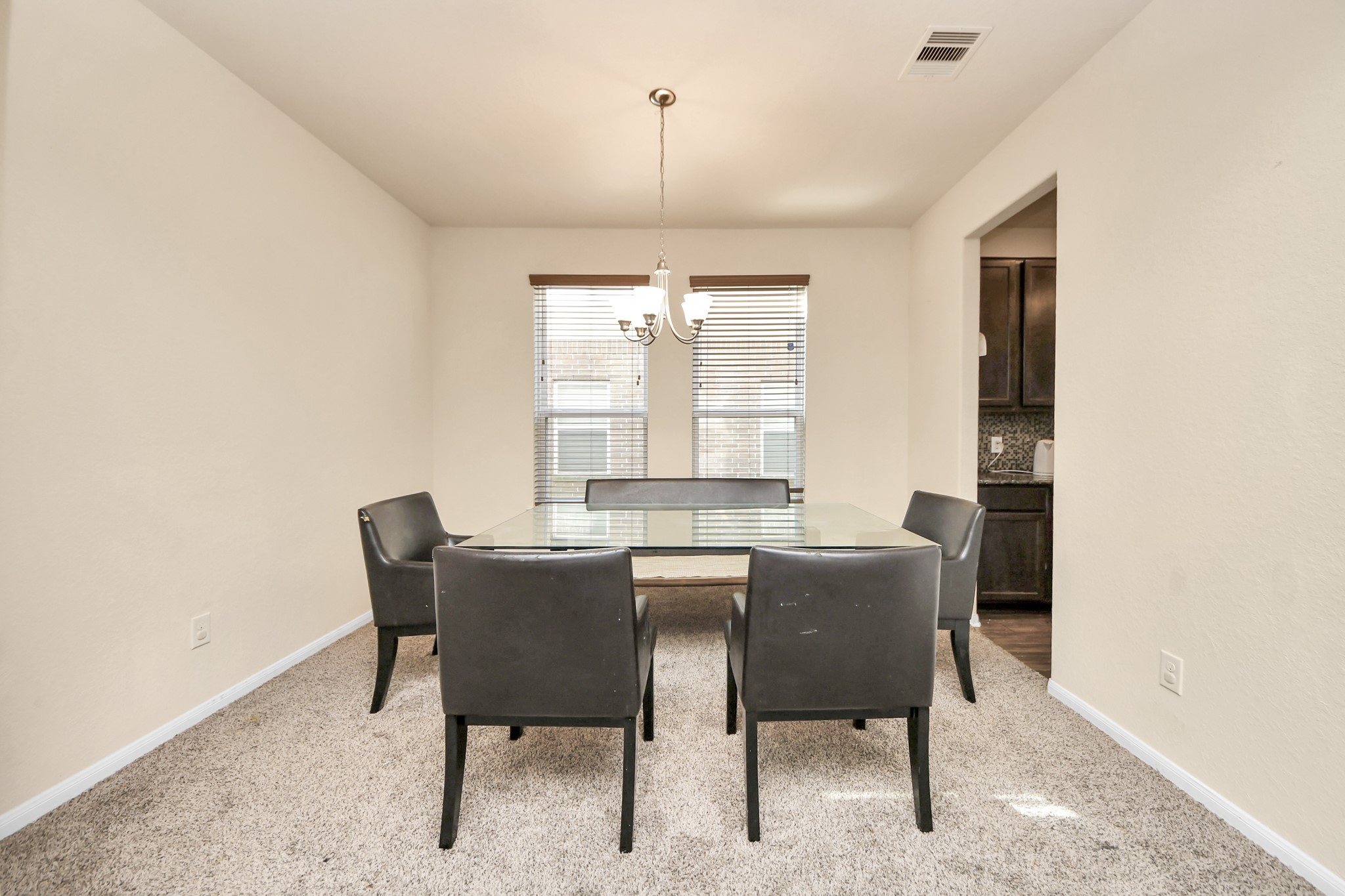 8227 Pastel Dawn Trace Houston, TX 77049 - Photo 8 of 29 a dining room with furniture and window
