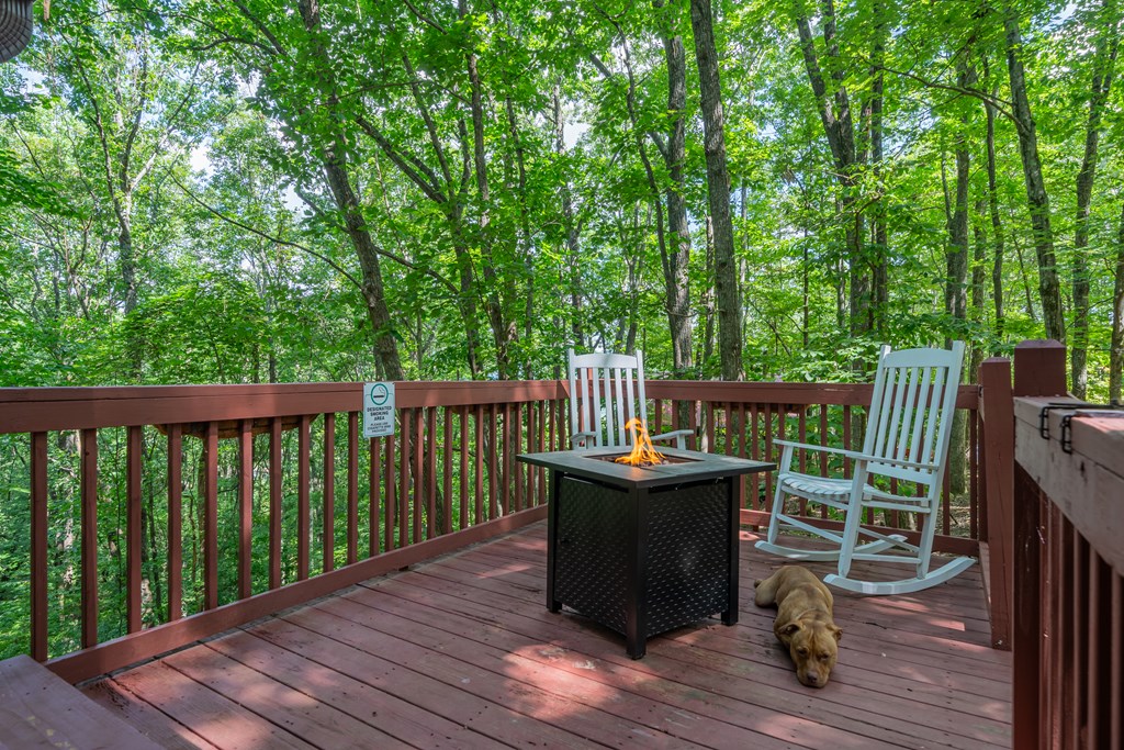 131 Hickory Trace Ellijay, GA 30536 - Photo 15 of 67 a view of a deck with chairs and wooden floor