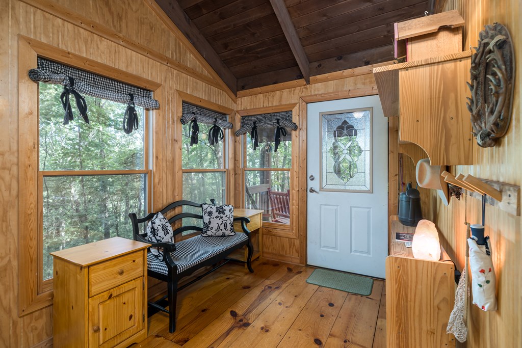 131 Hickory Trace Ellijay, GA 30536 - Photo 17 of 67 a bedroom with furniture and large windows