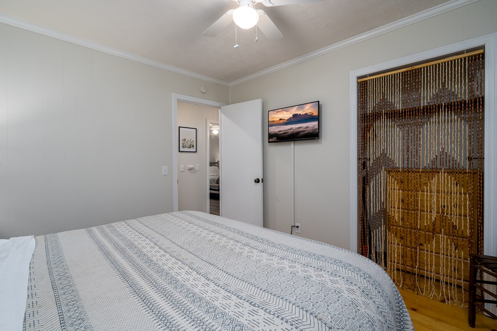 131 Hickory Trace Ellijay, GA 30536 - Photo 29 of 67 a bedroom with a bed and a walk in closet