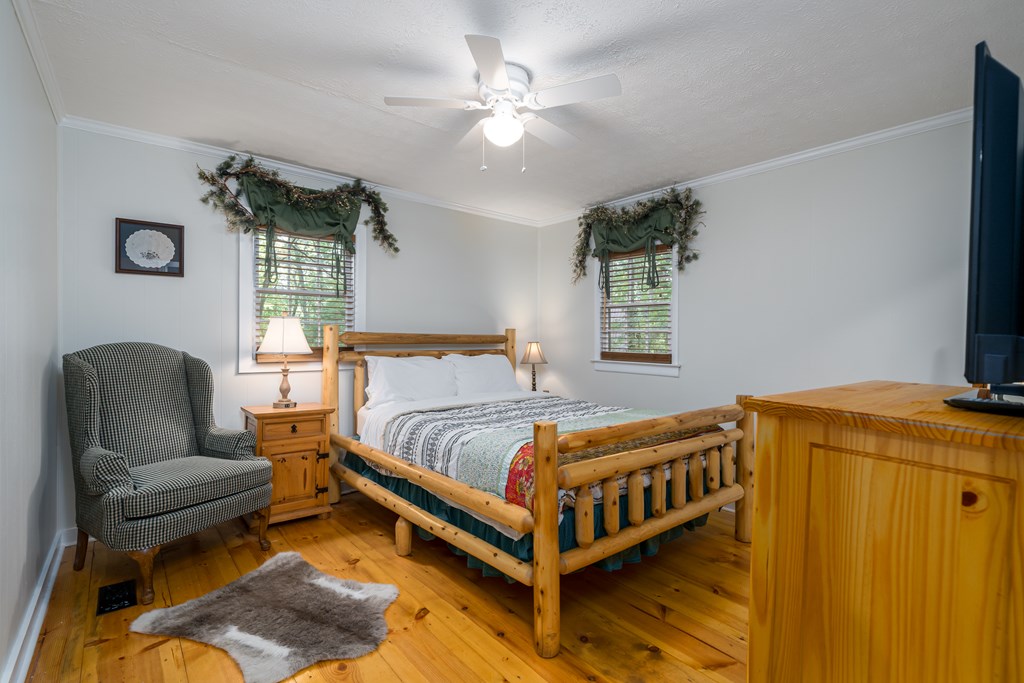 131 Hickory Trace Ellijay, GA 30536 - Photo 33 of 67 a bedroom with a bed and window
