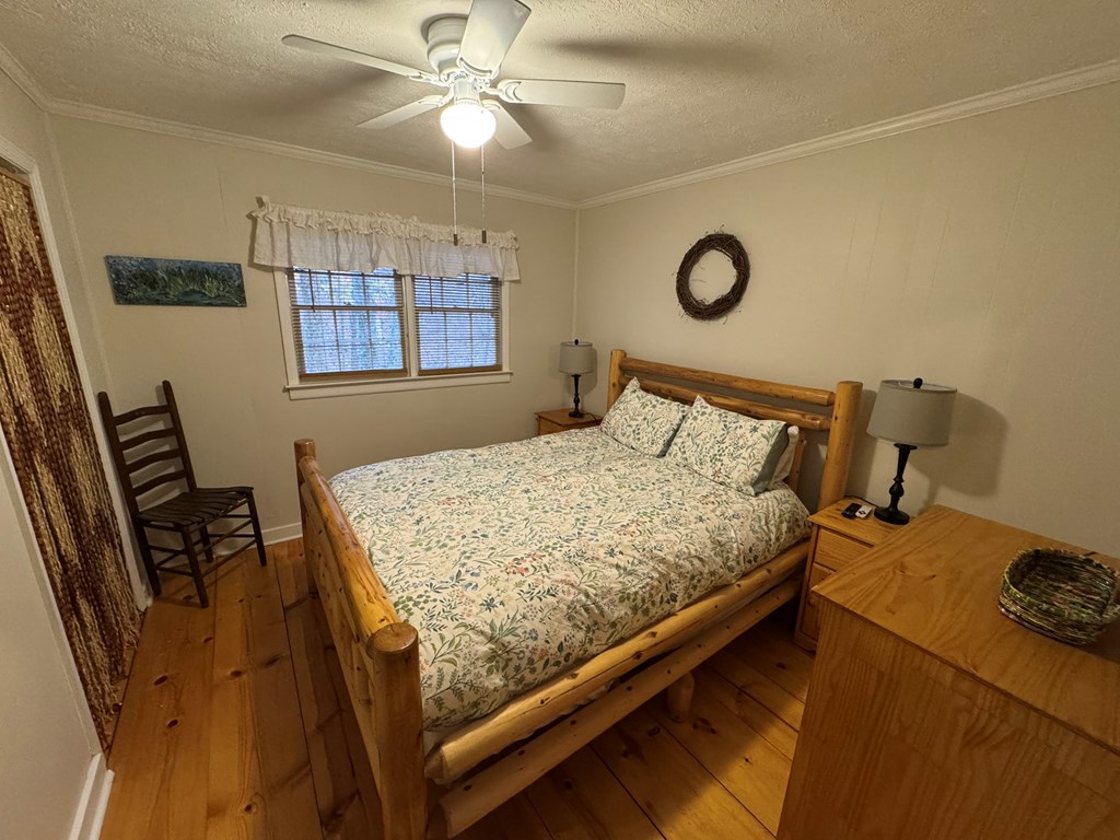 131 Hickory Trace Ellijay, GA 30536 - Photo 42 of 67 a bed sitting in a bedroom next to a window