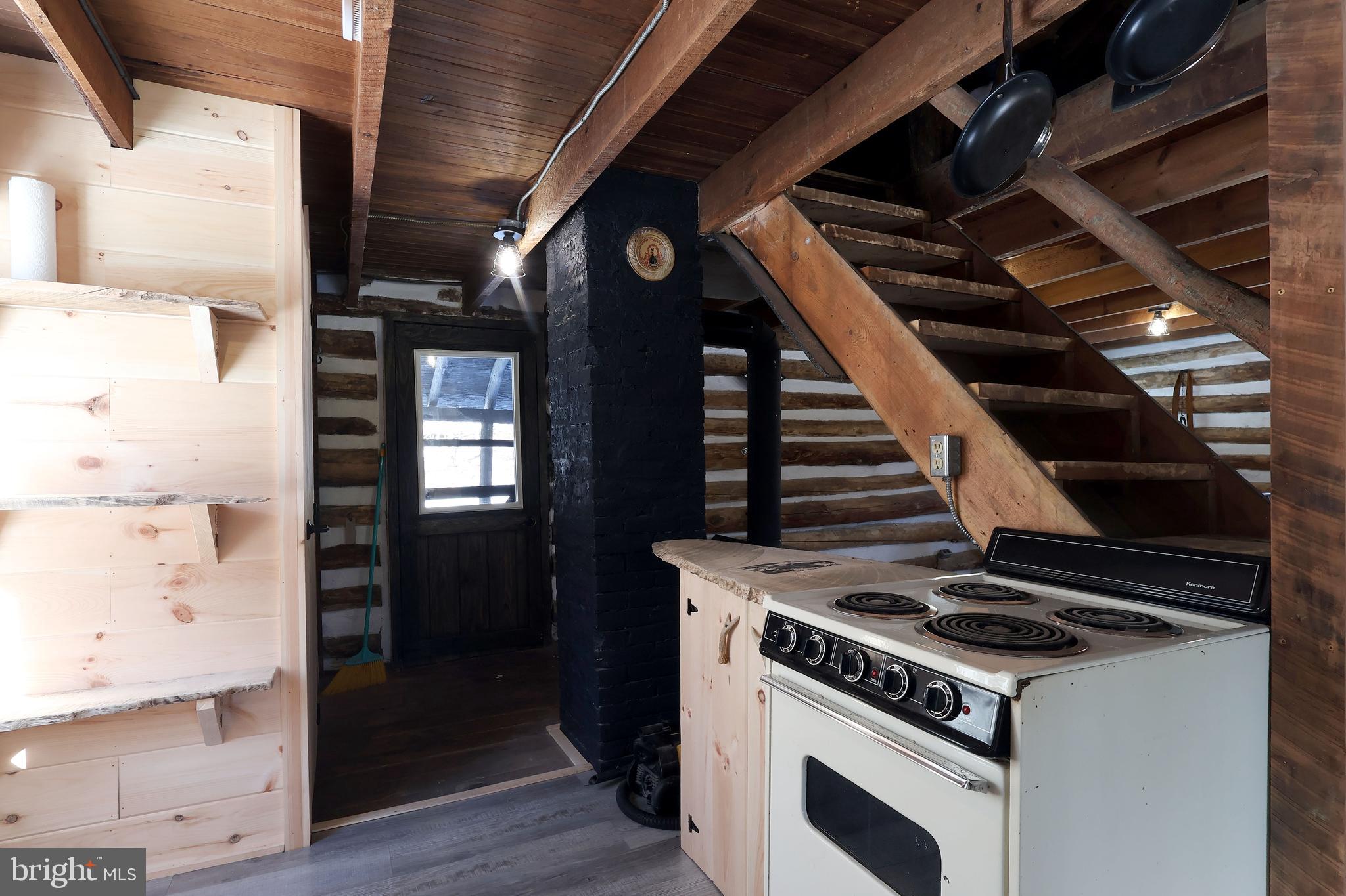 4464 Tram Road Spruce Creek, PA 16683 - Photo 36 of 50 a stove top oven sitting inside of a kitchen