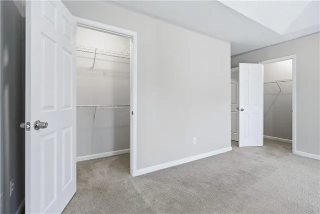a bathroom with a sink double vanity granite and a mirror