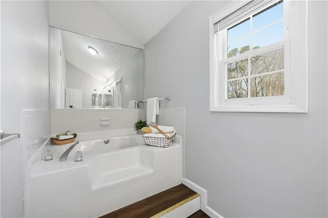 a bathroom with a shower and a sink