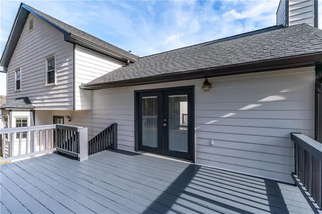 a view of a balcony with wooden floor