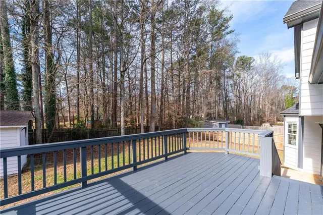 a view of a house with a yard and seating space