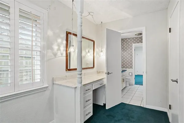 a bathroom with a double vanity sink a mirror and a bathtub
