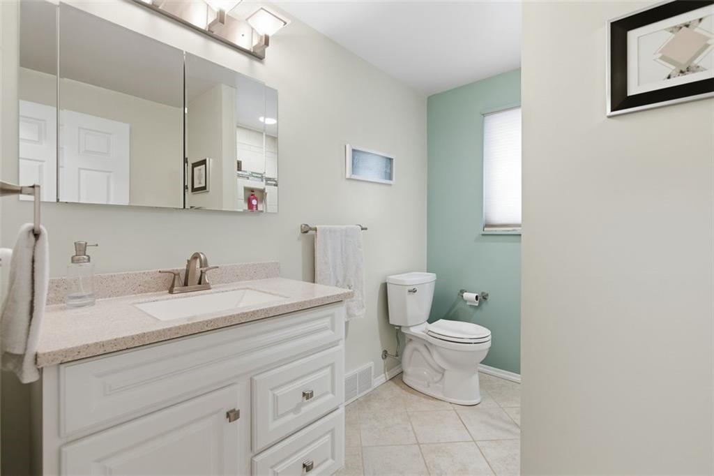 120 Crestview Manor Monongahela, PA 15063 - Photo 18 of 39 a bathroom with a granite countertop sink a toilet and a mirror