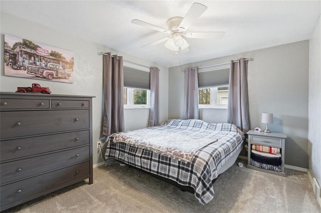 120 Crestview Manor Monongahela, PA 15063 - Photo 22 of 39 a bedroom with a bed and a chandelier