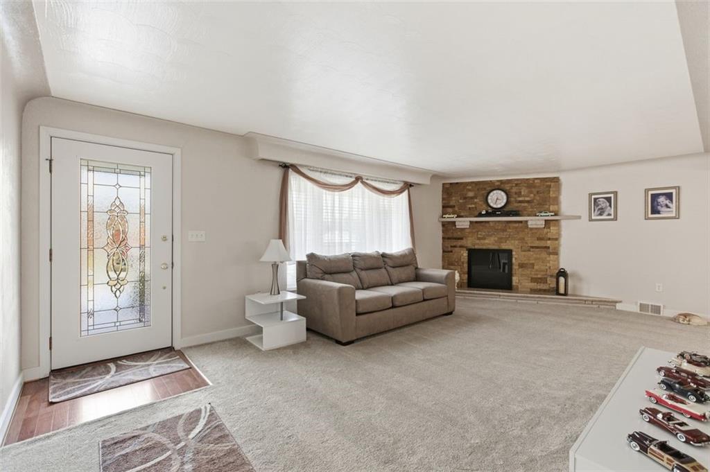 120 Crestview Manor Monongahela, PA 15063 - Photo 7 of 39 a living room with furniture a window and a fireplace