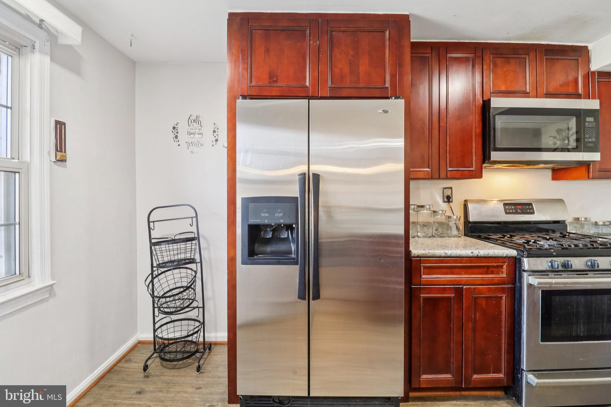1456 Potomac Heights Drive, Unit 145 Fort Washington, MD 20744 - Photo 19 of 50 a kitchen with stainless steel appliances granite countertop a refrigerator and a stove top oven