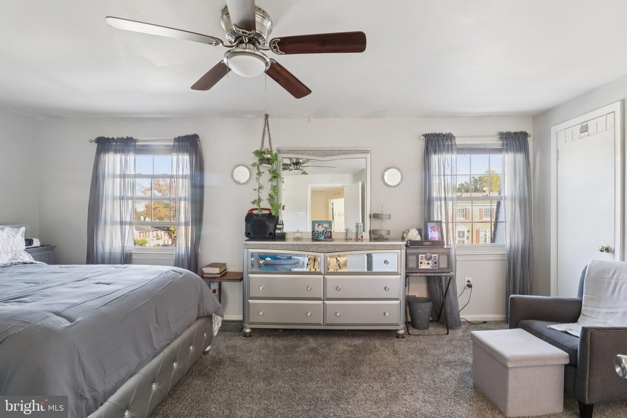 1456 Potomac Heights Drive, Unit 145 Fort Washington, MD 20744 - Photo 22 of 50 a bedroom with a bed and a chandelier