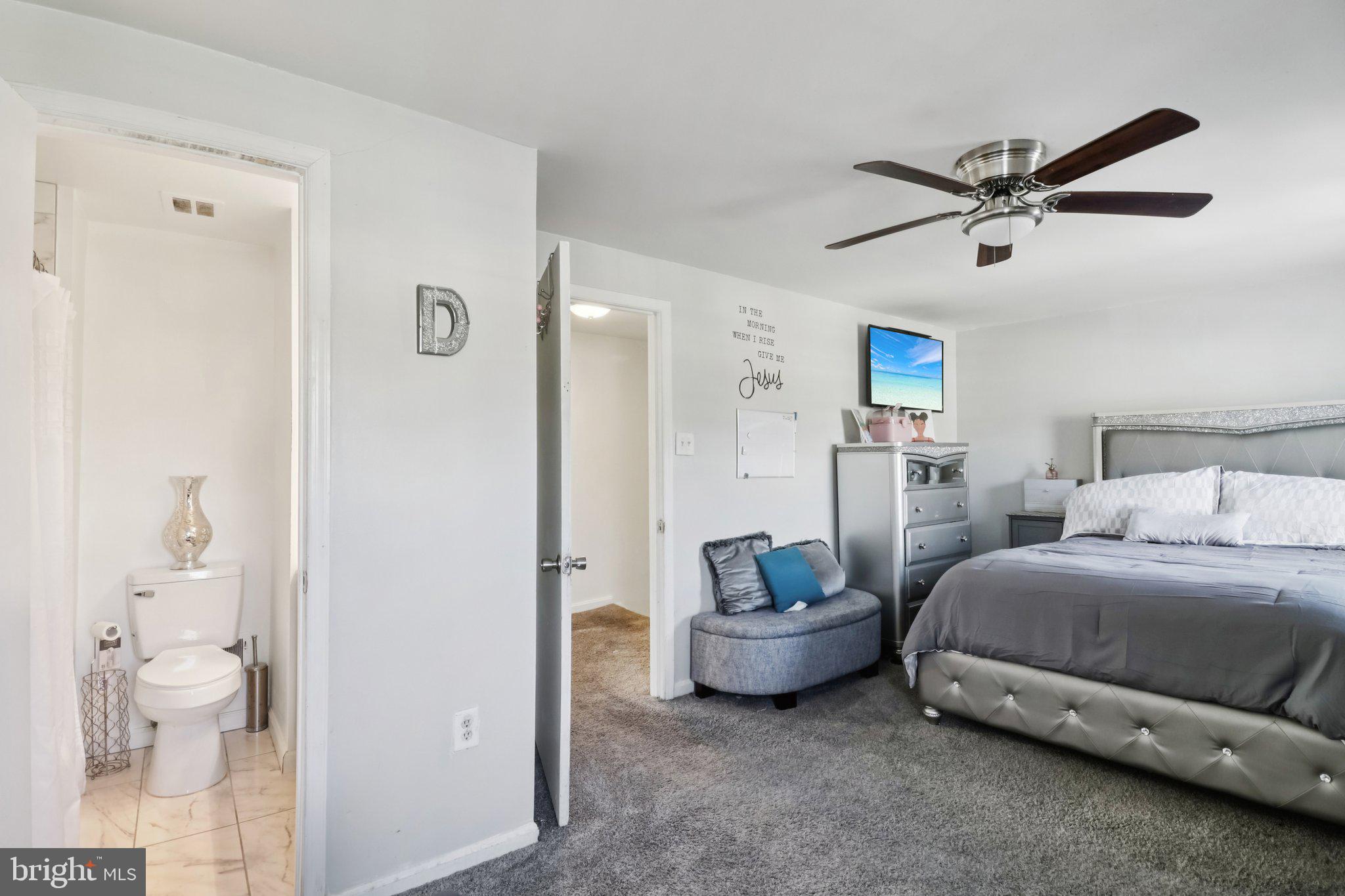 1456 Potomac Heights Drive, Unit 145 Fort Washington, MD 20744 - Photo 25 of 50 a spacious bedroom with a bed and ceiling fan