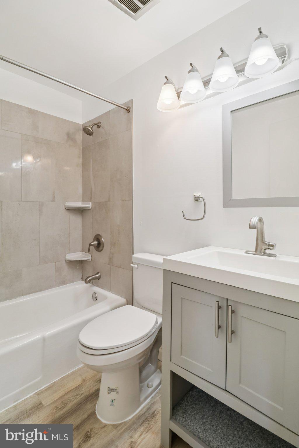1456 Potomac Heights Drive, Unit 145 Fort Washington, MD 20744 - Photo 30 of 50 a bathroom with a sink toilet and shower