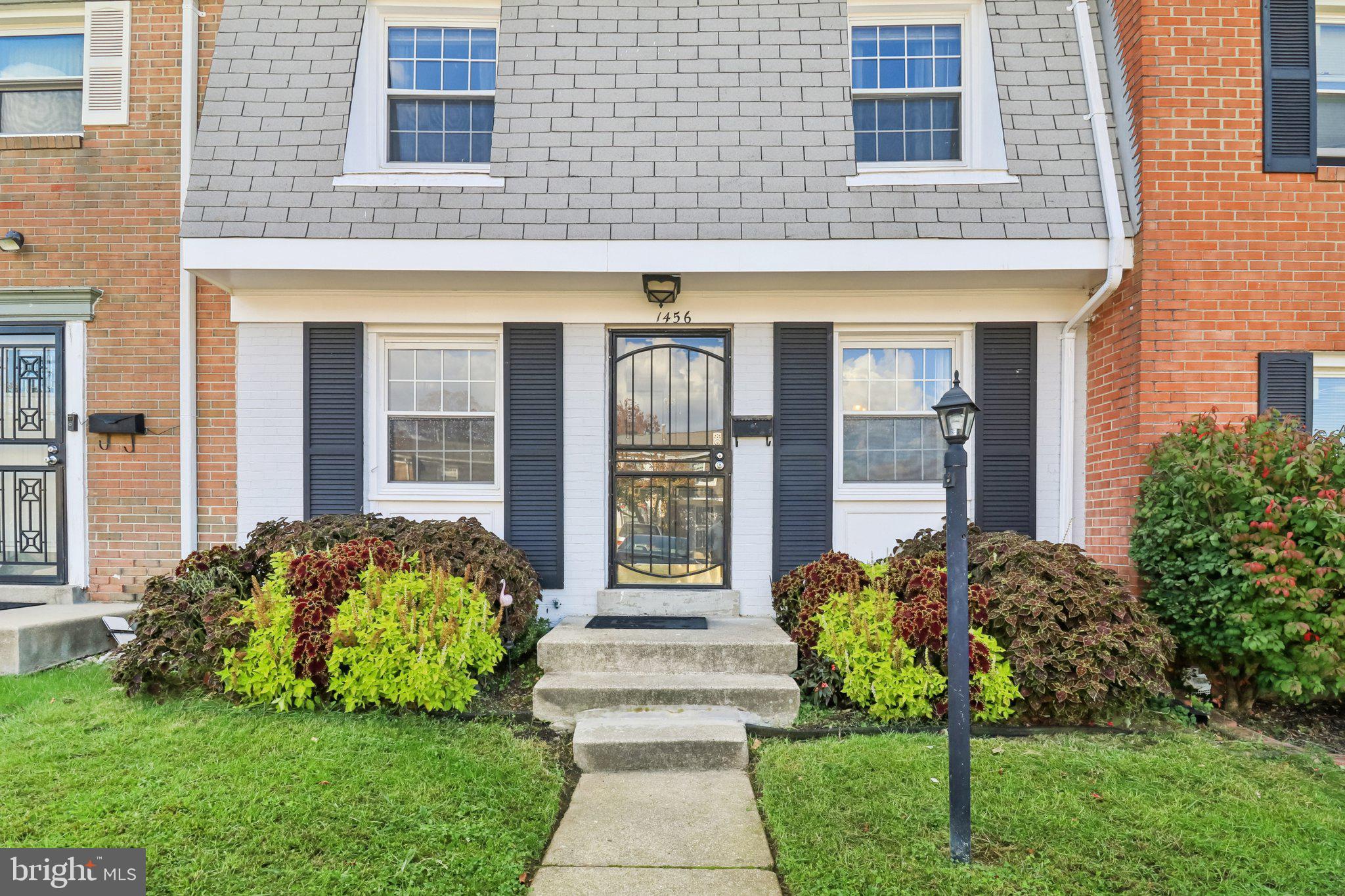 1456 Potomac Heights Drive, Unit 145 Fort Washington, MD 20744 - Photo 3 of 50 a front view of a house with garden