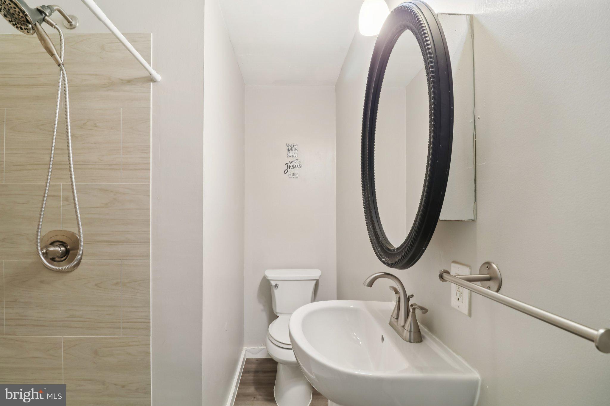 1456 Potomac Heights Drive, Unit 145 Fort Washington, MD 20744 - Photo 37 of 50 a bathroom with a sink and a mirror