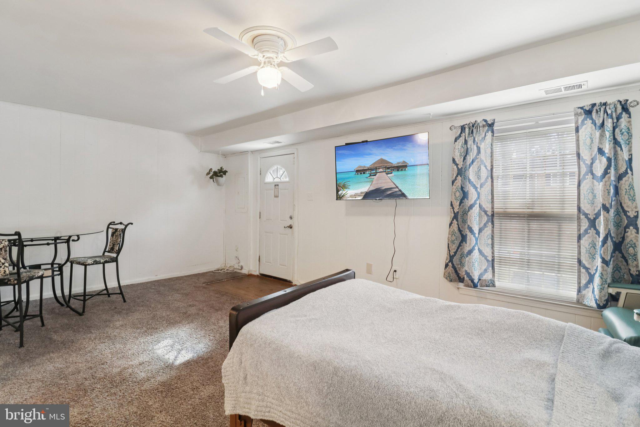 1456 Potomac Heights Drive, Unit 145 Fort Washington, MD 20744 - Photo 40 of 50 a bedroom with a bed and a chandelier