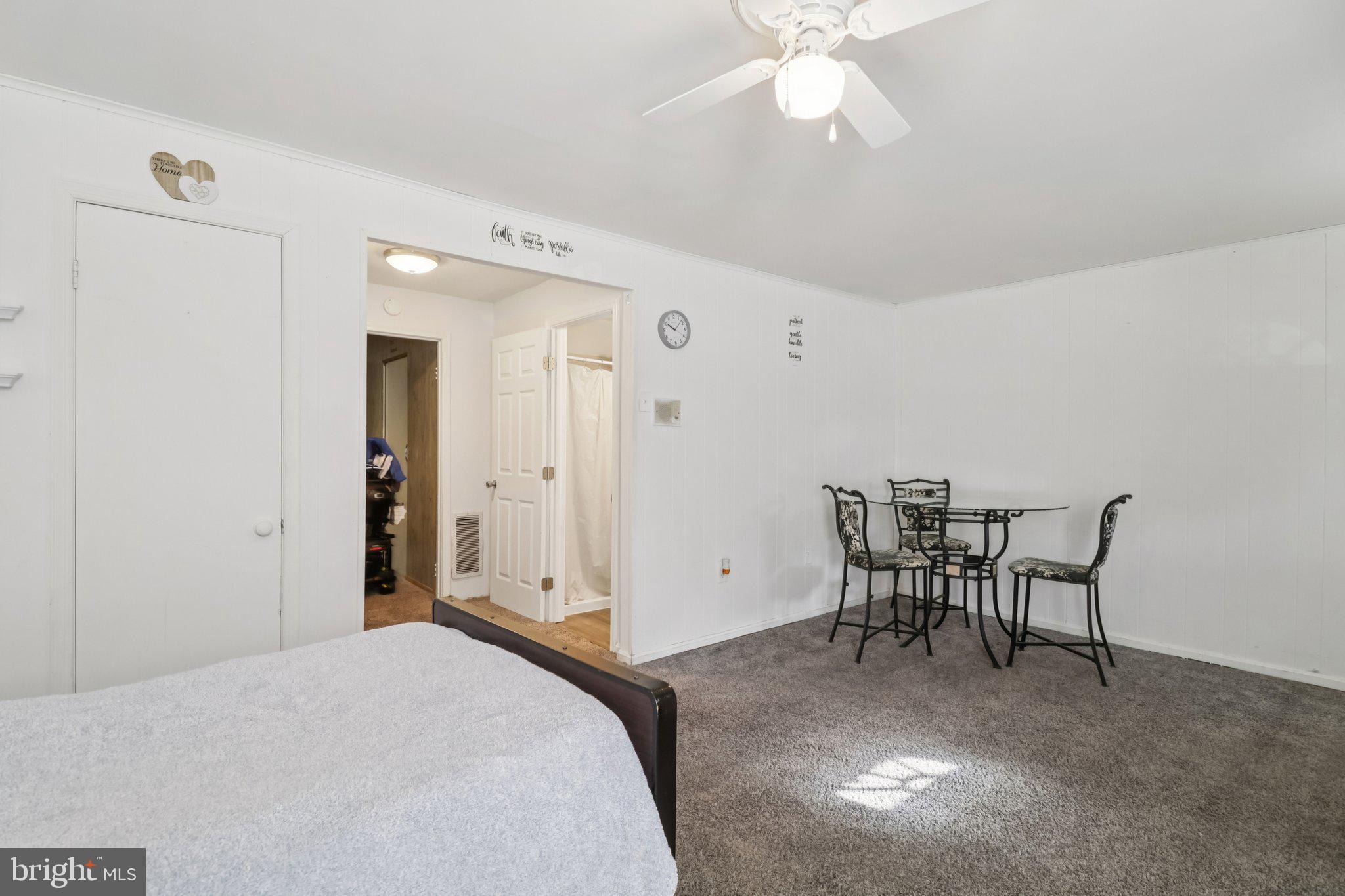 1456 Potomac Heights Drive, Unit 145 Fort Washington, MD 20744 - Photo 41 of 50 a bedroom with a bed and a table in it