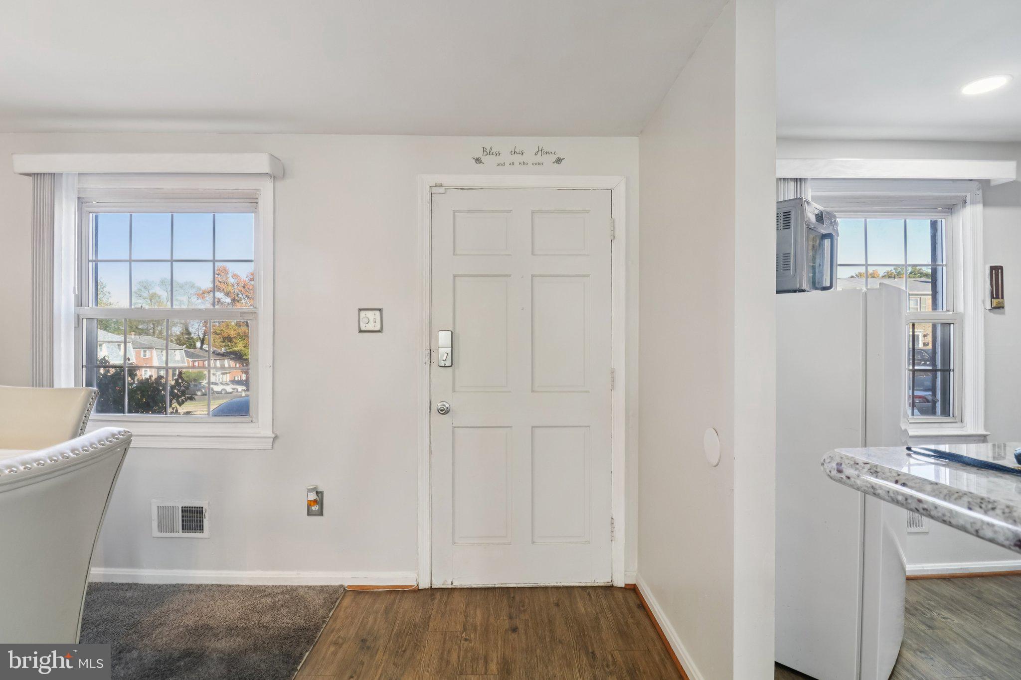 1456 Potomac Heights Drive, Unit 145 Fort Washington, MD 20744 - Photo 5 of 50 a view of an empty room with wooden floor and a window