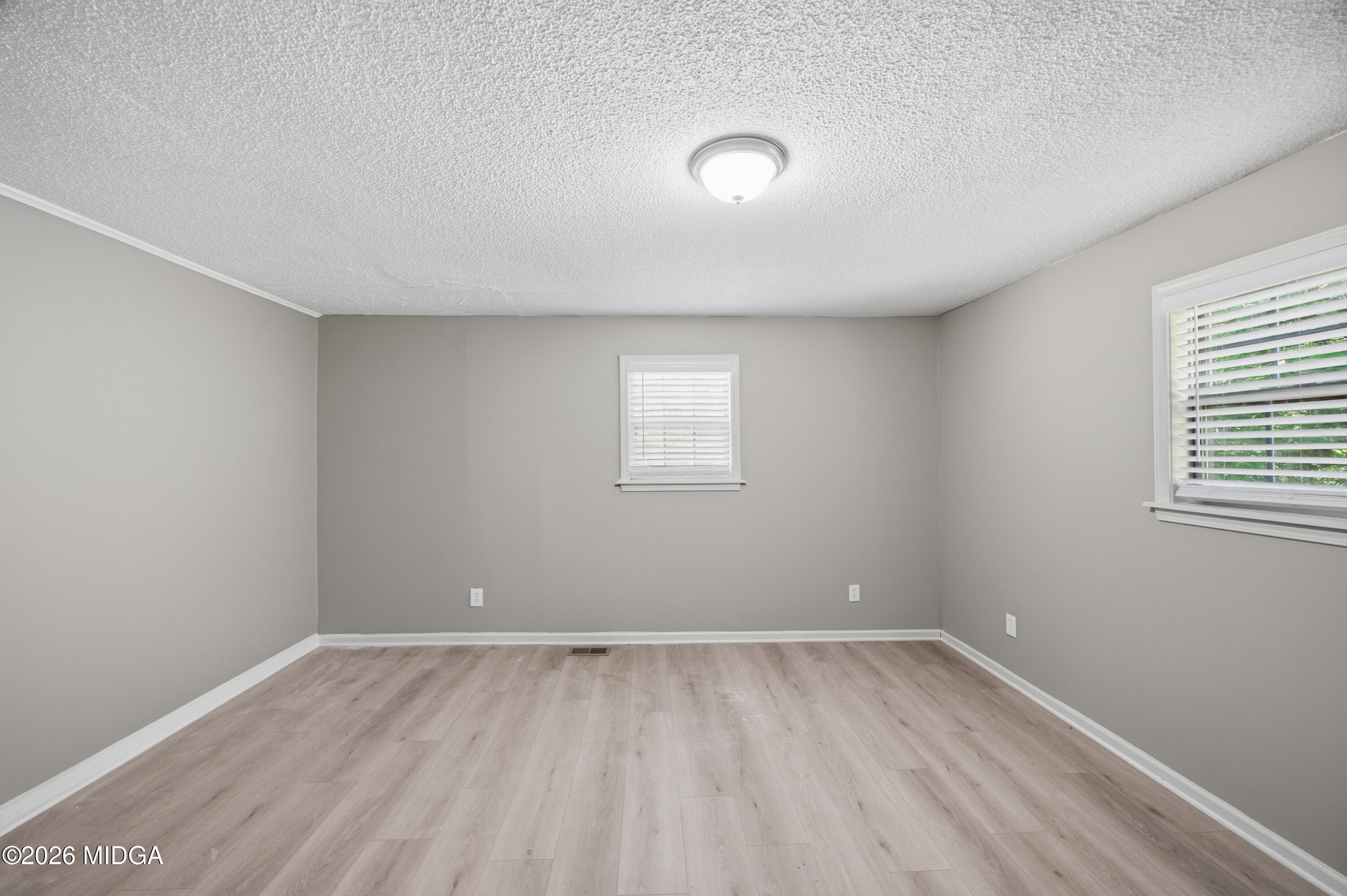 427 Gun Club Road Fort Valley, GA 31030 - Photo 17 of 26 an empty room with a window