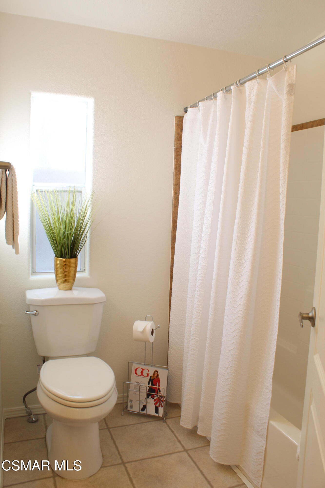 59 Farland Drive Thousand Oaks, CA 91320 - Photo 14 of 24 a bathroom with a toilet and a shower curtain