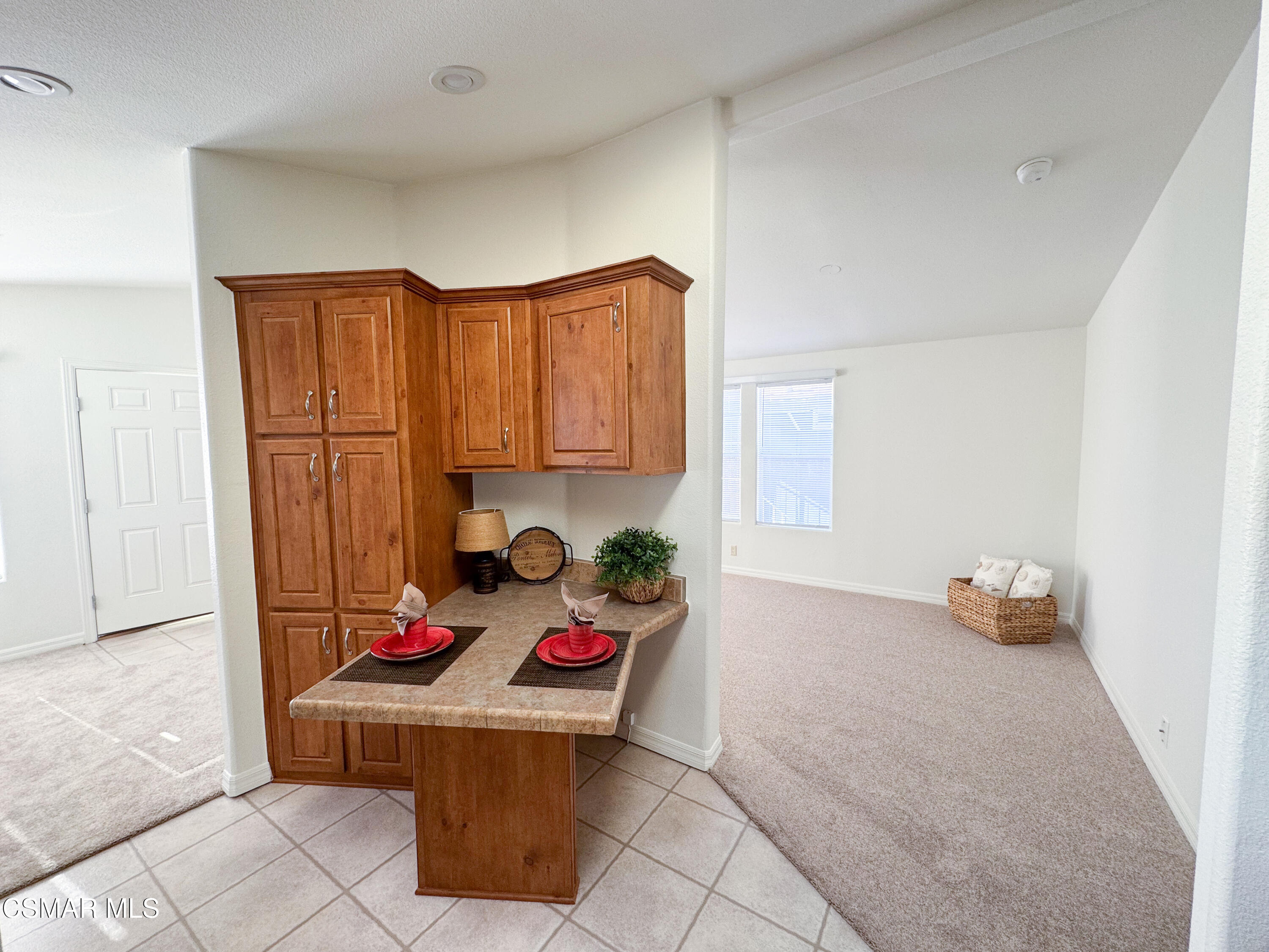 59 Farland Drive Thousand Oaks, CA 91320 - Photo 5 of 24 a kitchen with a refrigerator and a stove top oven