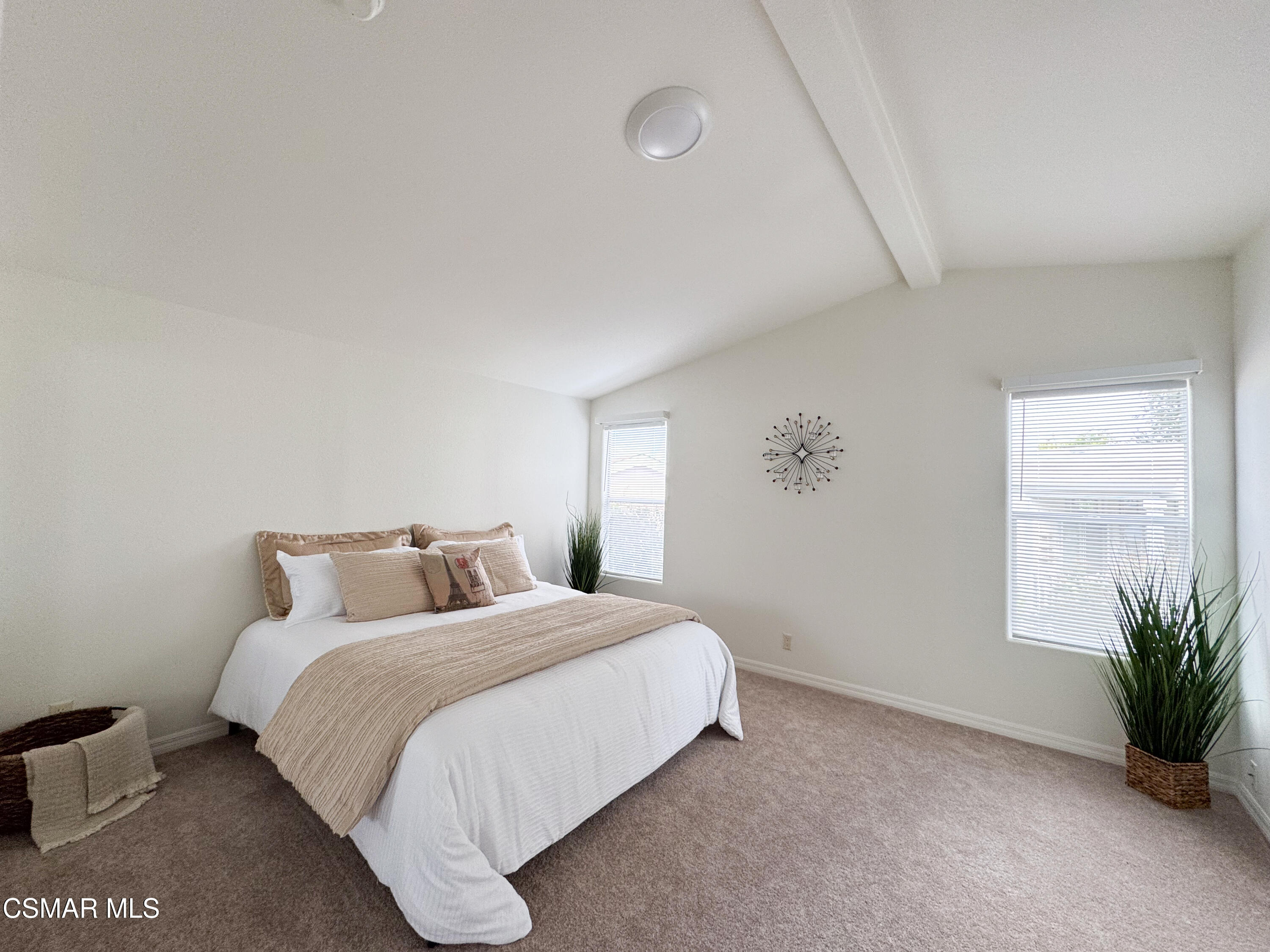 59 Farland Drive Thousand Oaks, CA 91320 - Photo 10 of 24 a bedroom with a large bed and a potted plant