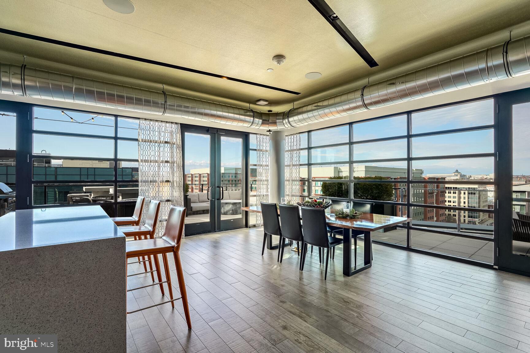 1300 4th Street Southeast, Unit 413 Washington, DC 20003 - Photo 17 of 29 a view of a dining room with furniture and wooden floor