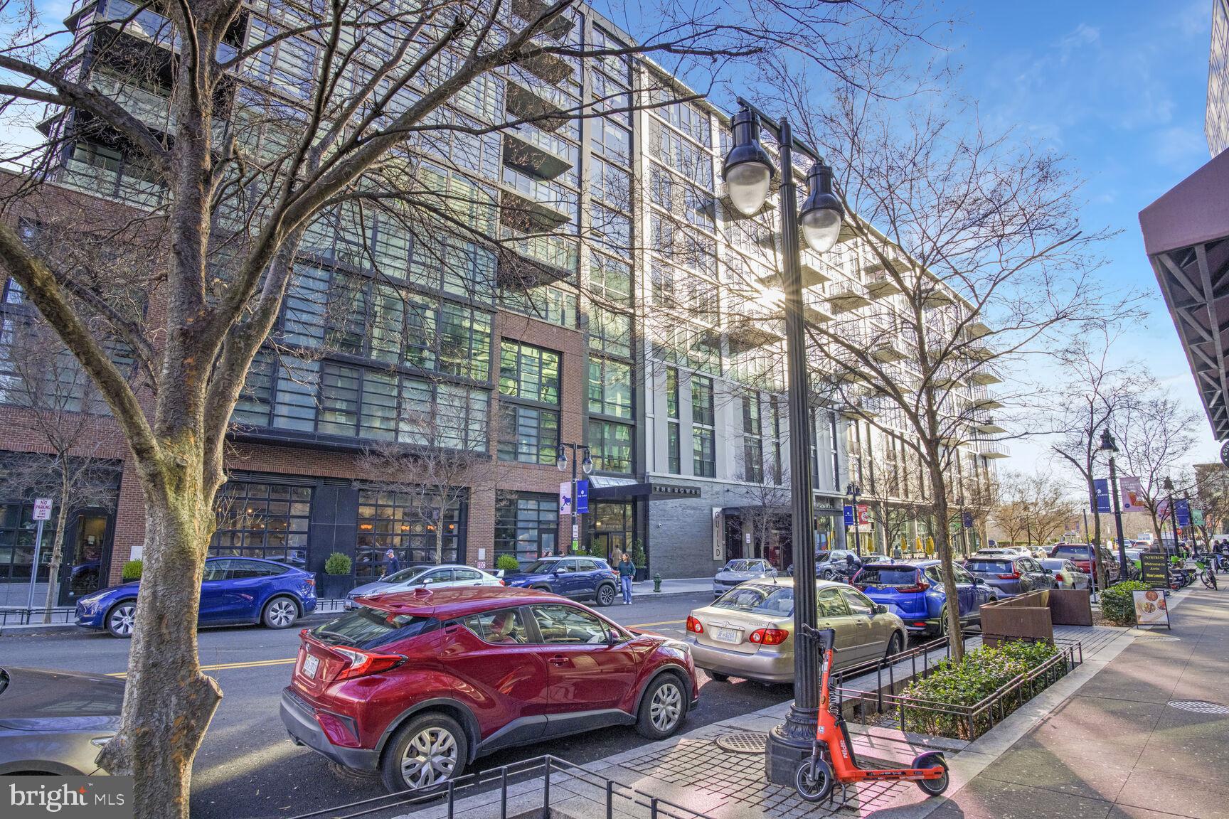 1300 4th Street Southeast, Unit 413 Washington, DC 20003 - Photo 20 of 29 a front view of a building with cars parked