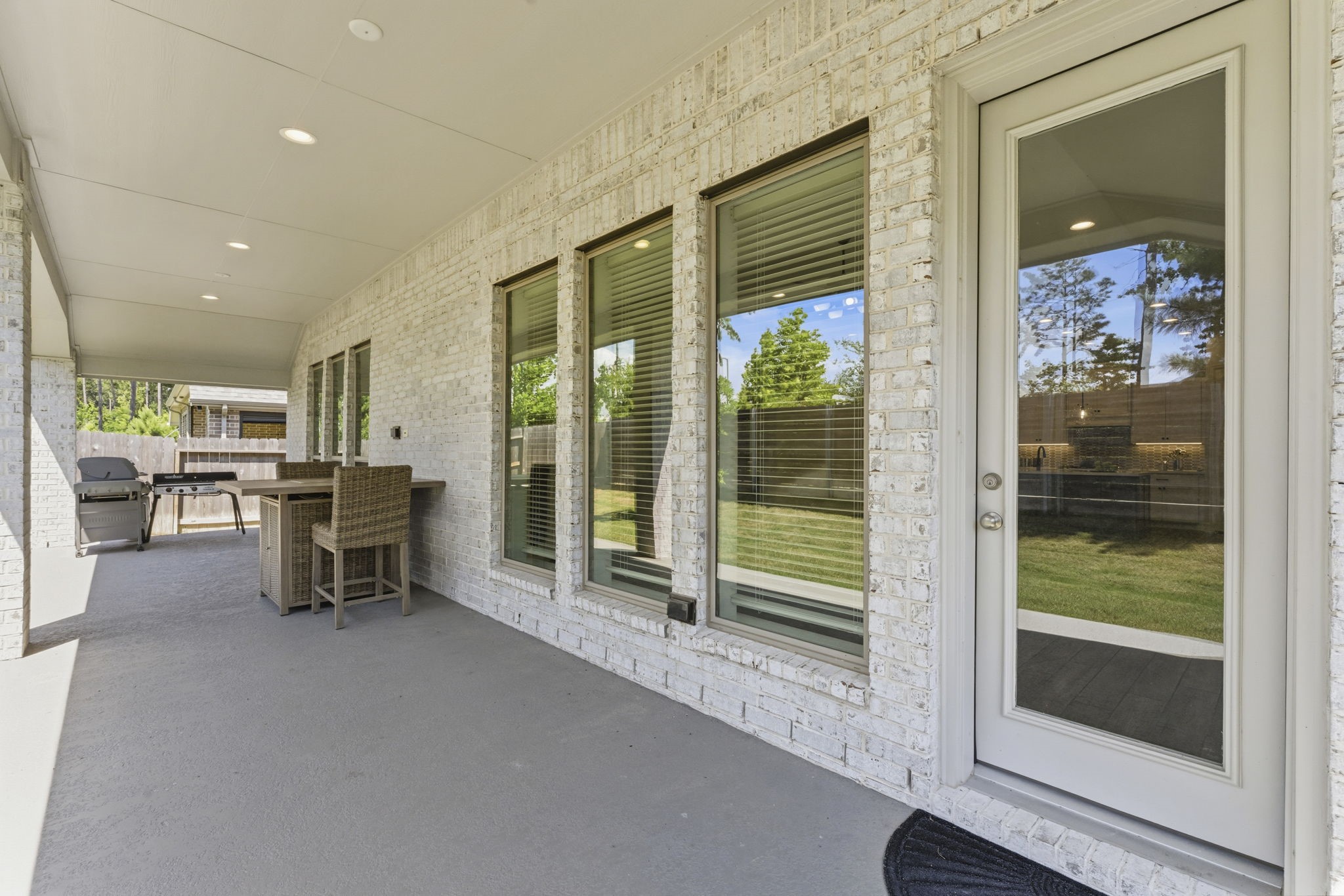 15618 Turtlehead Trail Conroe, TX 77302 - Photo 10 of 50 Cool Deck Flooring on Rear Covered Patio and Recessed Lighting w/Outlets for Fans, Electric and Cable